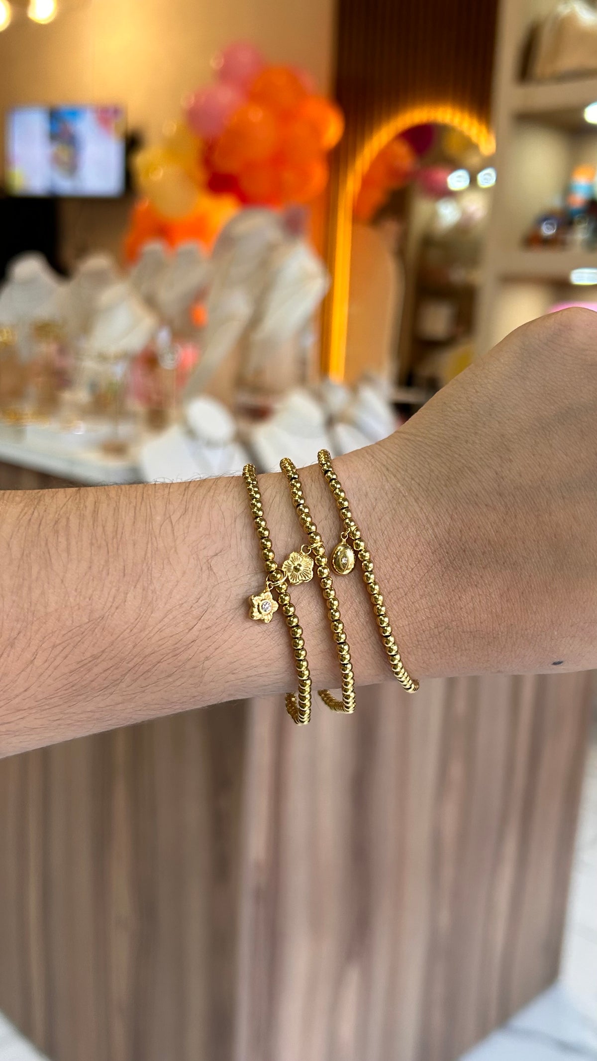 pulsera balines dije gota dorado