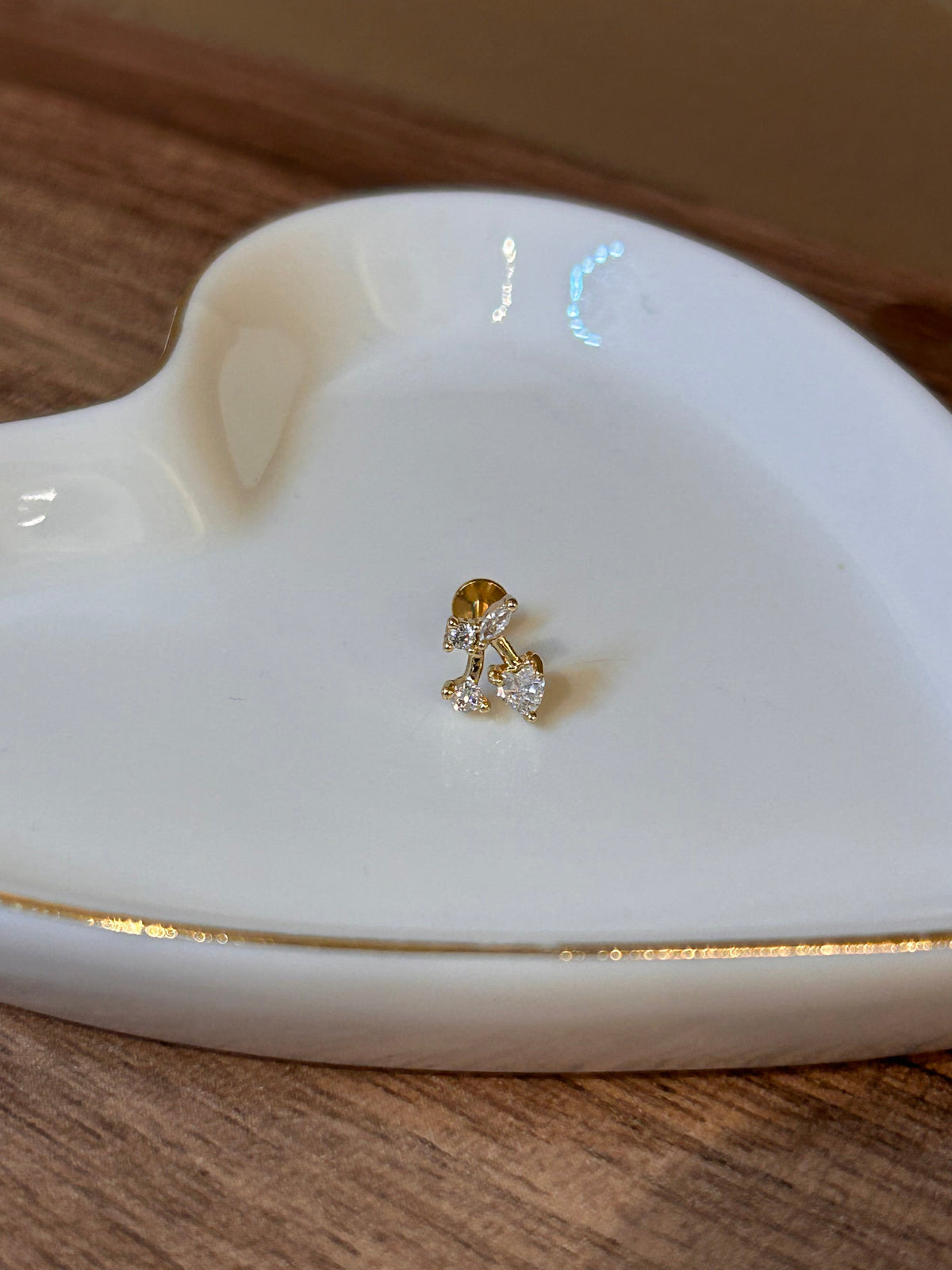 piercing cereza dorado