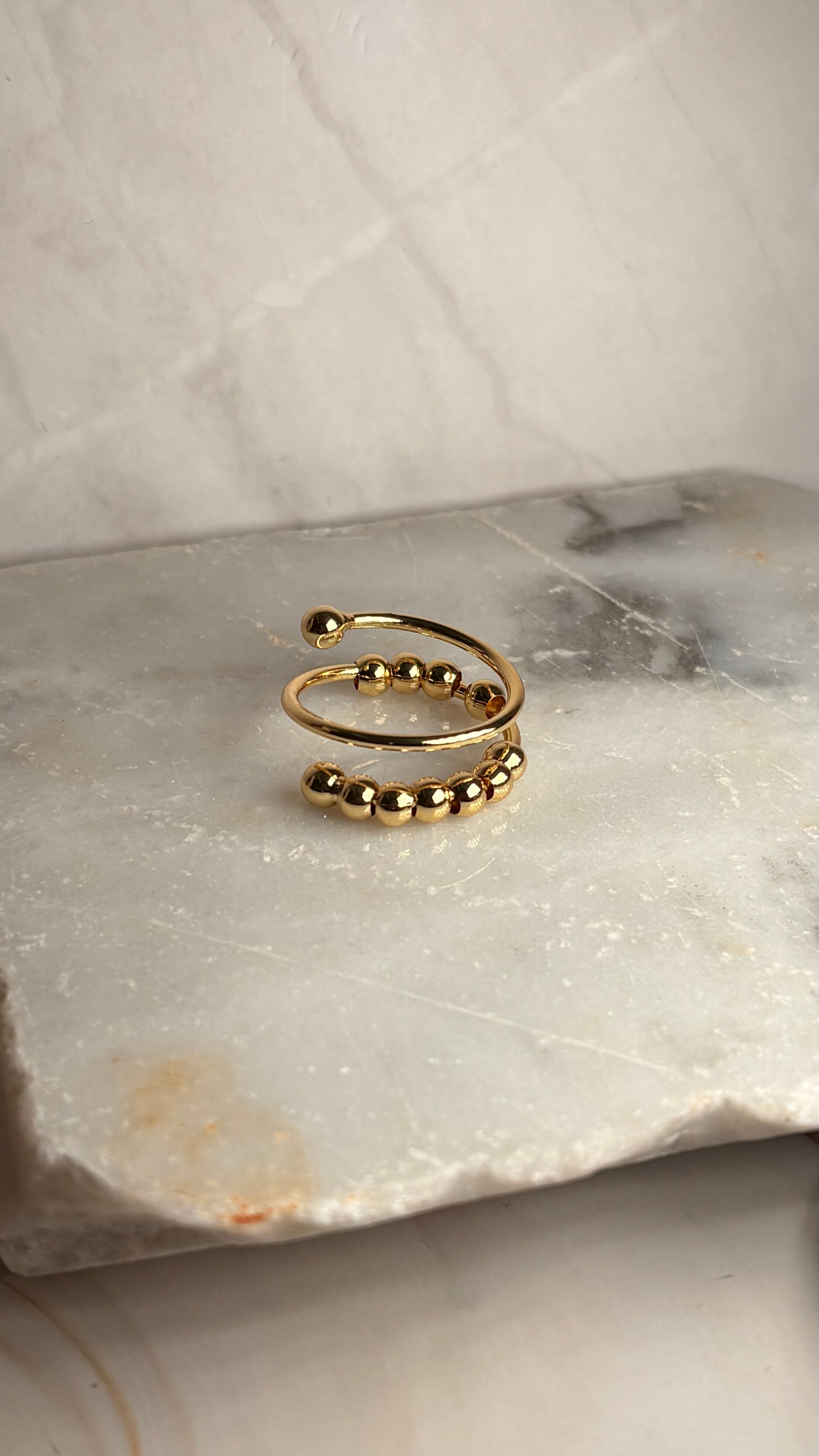 Anillo onda balines dorado