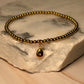 pulsera balines dije gota dorado