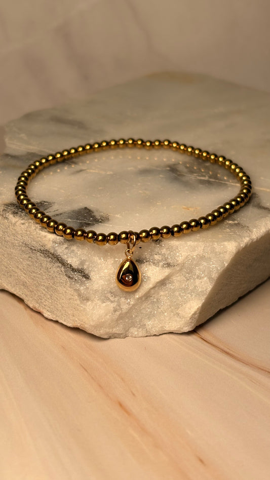 pulsera balines dije gota dorado
