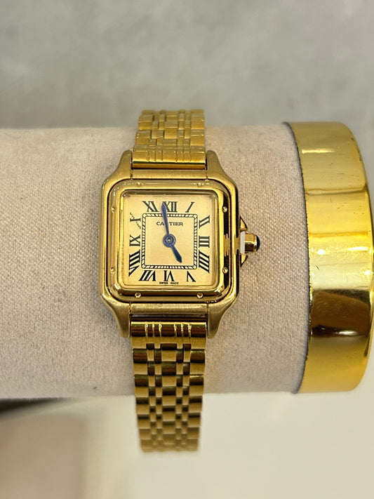 Reloj Cárter dorado (fondo dorado)