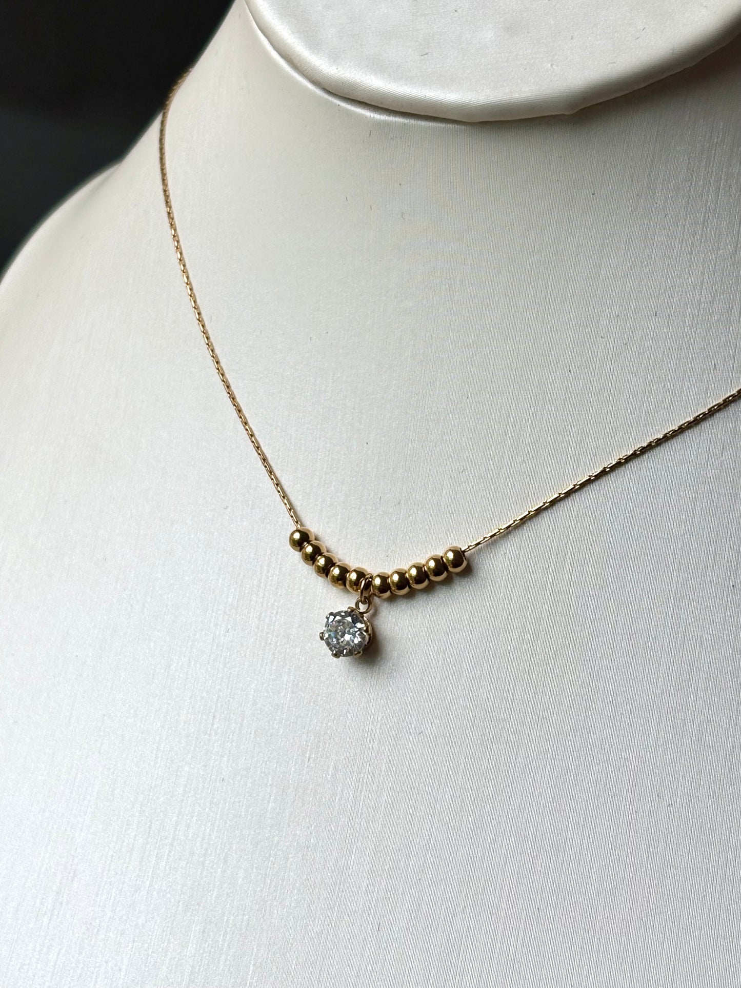 Collar mini bolitas dorado brillito