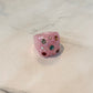 Anillo acrílico chunky rosa brillitos de colores