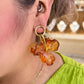 Aretes flor acrílico marrón