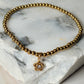 pulsera balines dije estrella dorado