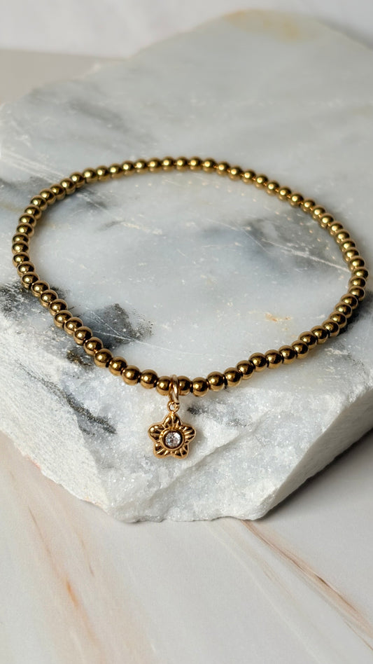 pulsera balines dije estrella dorado