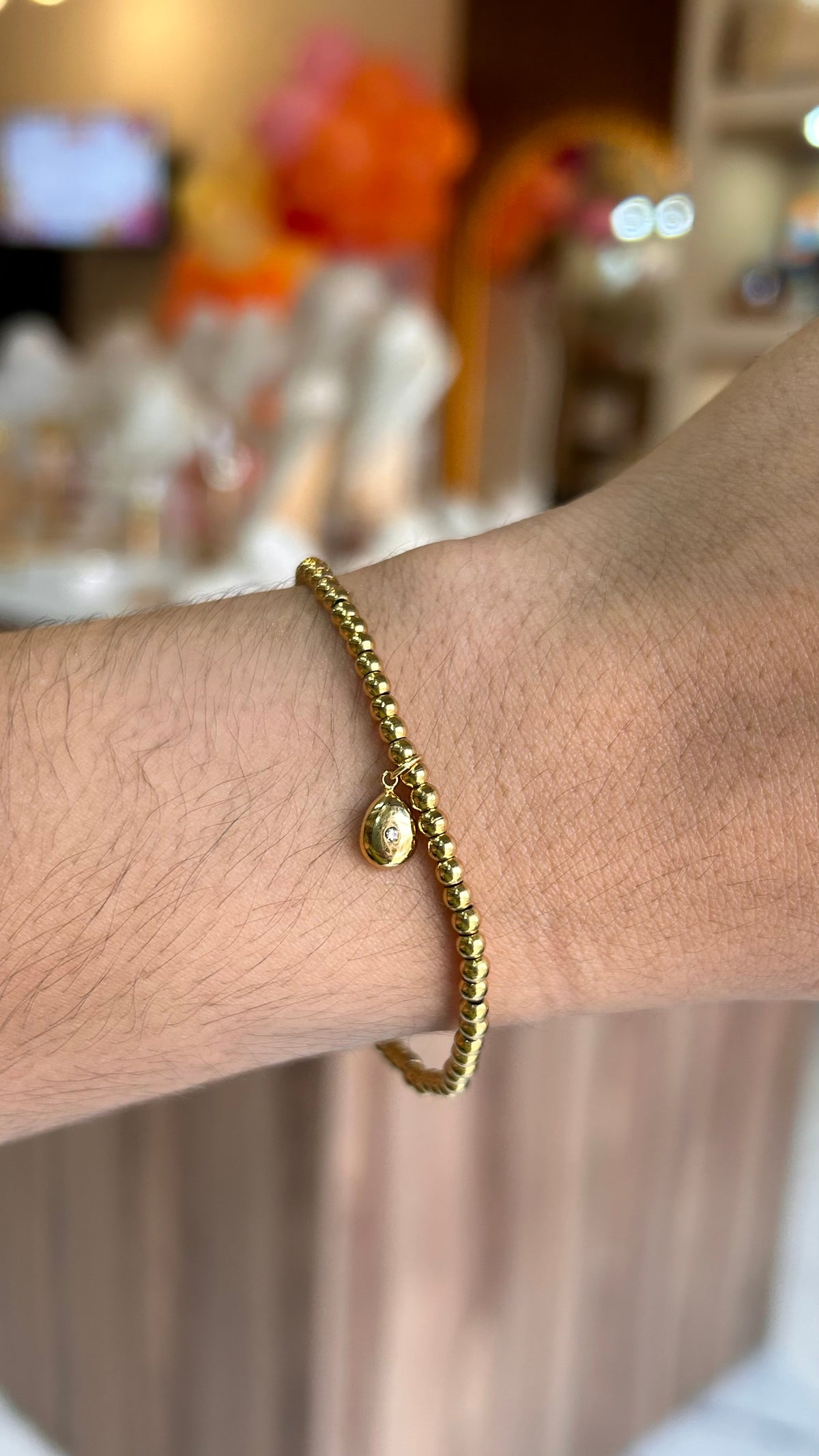pulsera balines dije gota dorado
