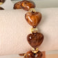 pulsera concha corazon cafe